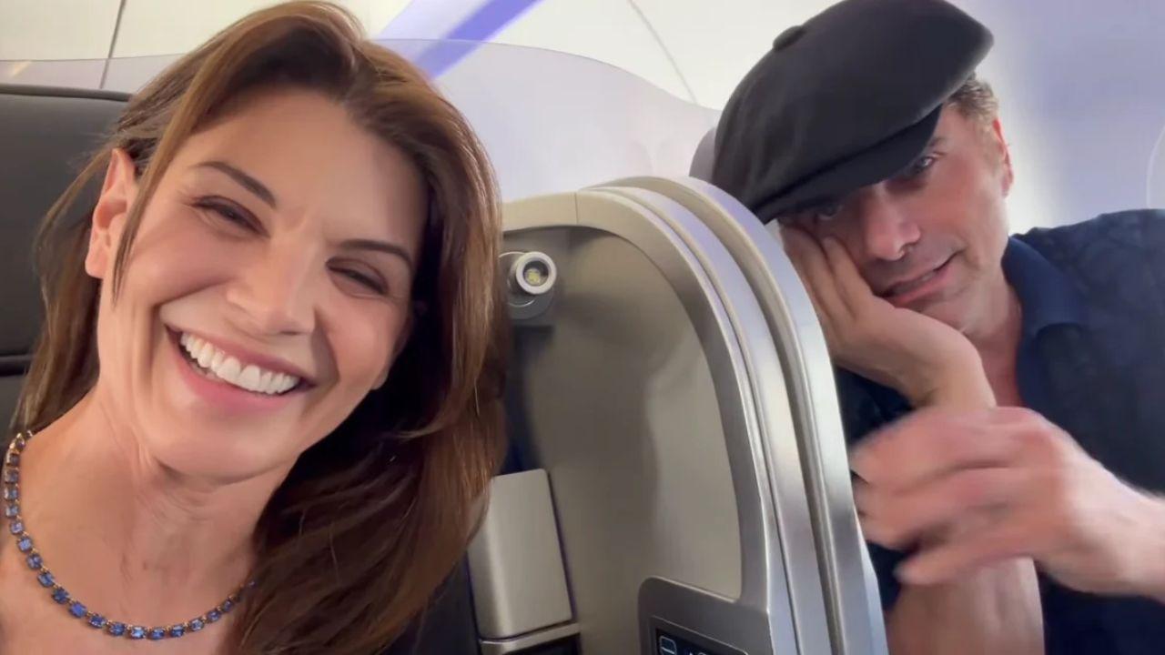 image of John tried to create some personal space between them during their flight.