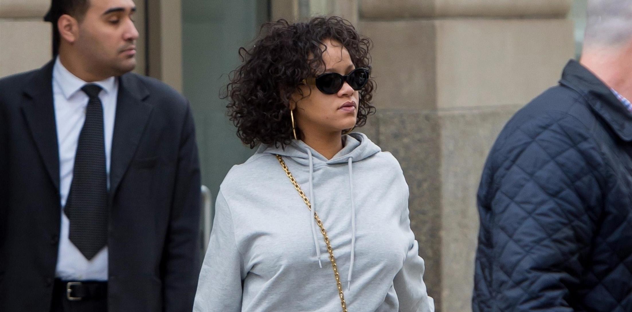 Rihanna flatters her curves in a low-cut blouse and skintight leggings in  NYC