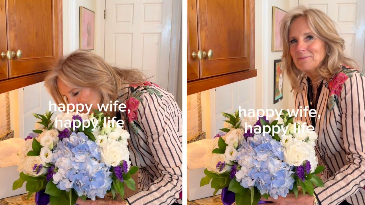 Image of The former first lady leaned over to smell an arrangement of blue hydrangeas, white roses and purple flowers.