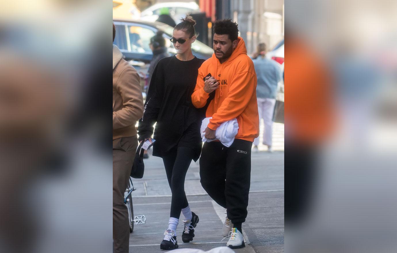 EXCLUSIVE: Bella Hadid and The Weeknd hold each other tight on a cold day in NYC