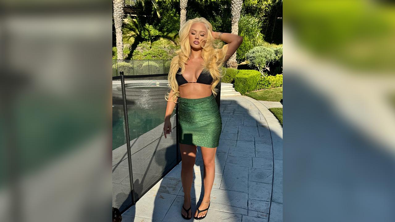 Image of In a separate upload, Alabama Barker went braless under a sheer dress.
