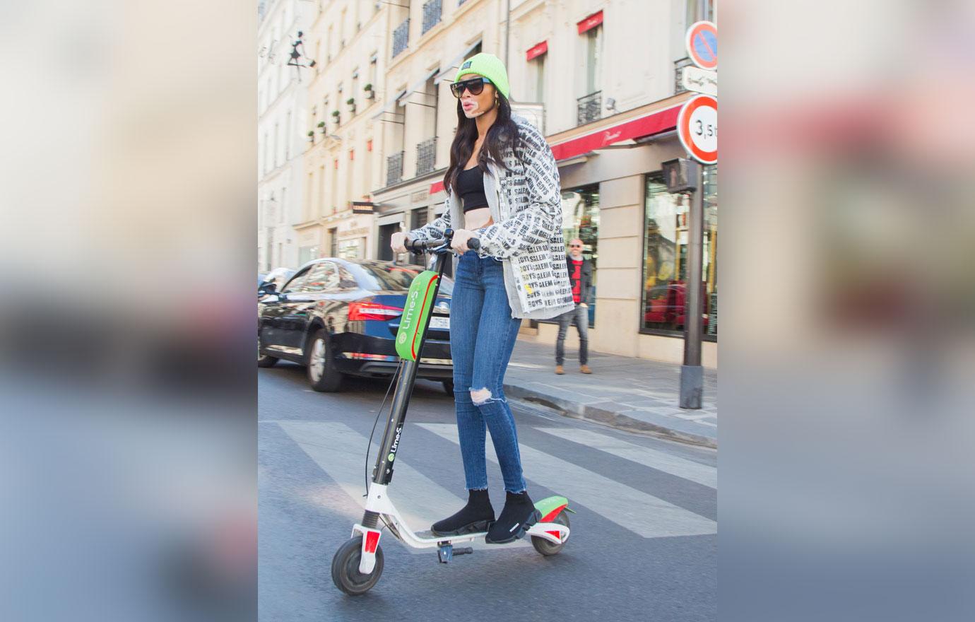 Winnie Harlow on a Lime Scooter