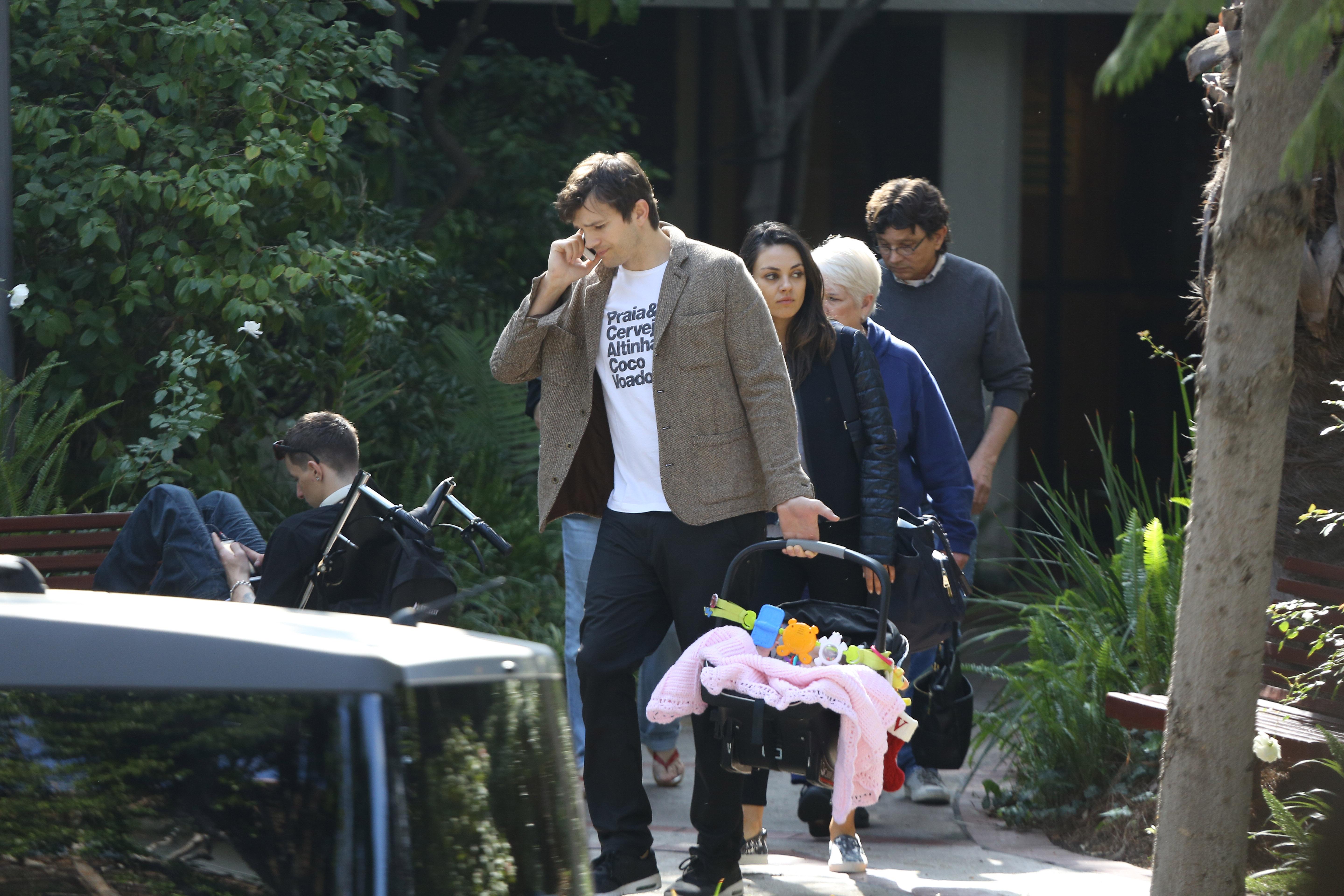 Ashton Kutcher and Mila Kunis enjoy a day out with baby girl Wyatt and parents