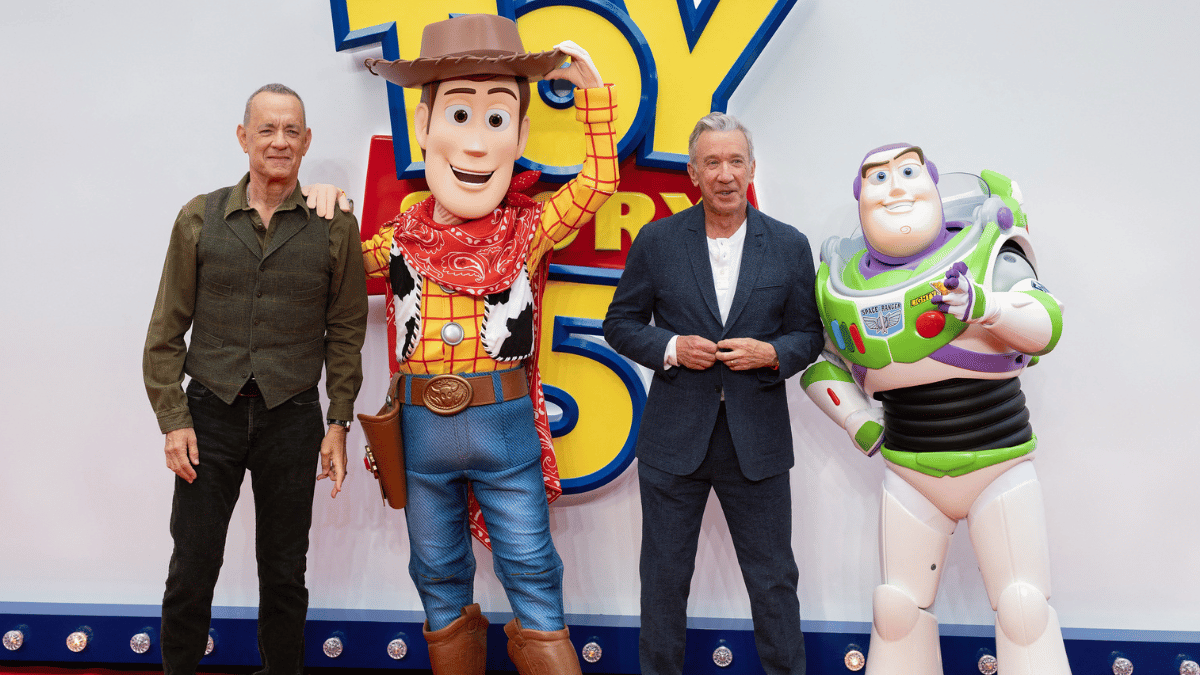 Photo of Tom Hanks with Woody and Tim Allen with Buzz Lightyear