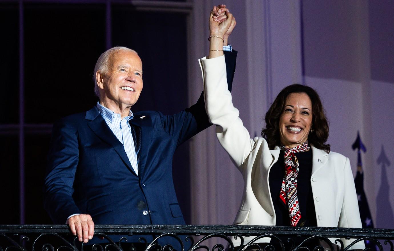 Photo of Joe Biden and Kamala Harris joining hands.