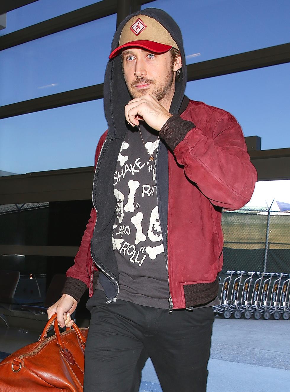 Ryan Gosling seen departing on a flight at LAX in Los Angeles, CA