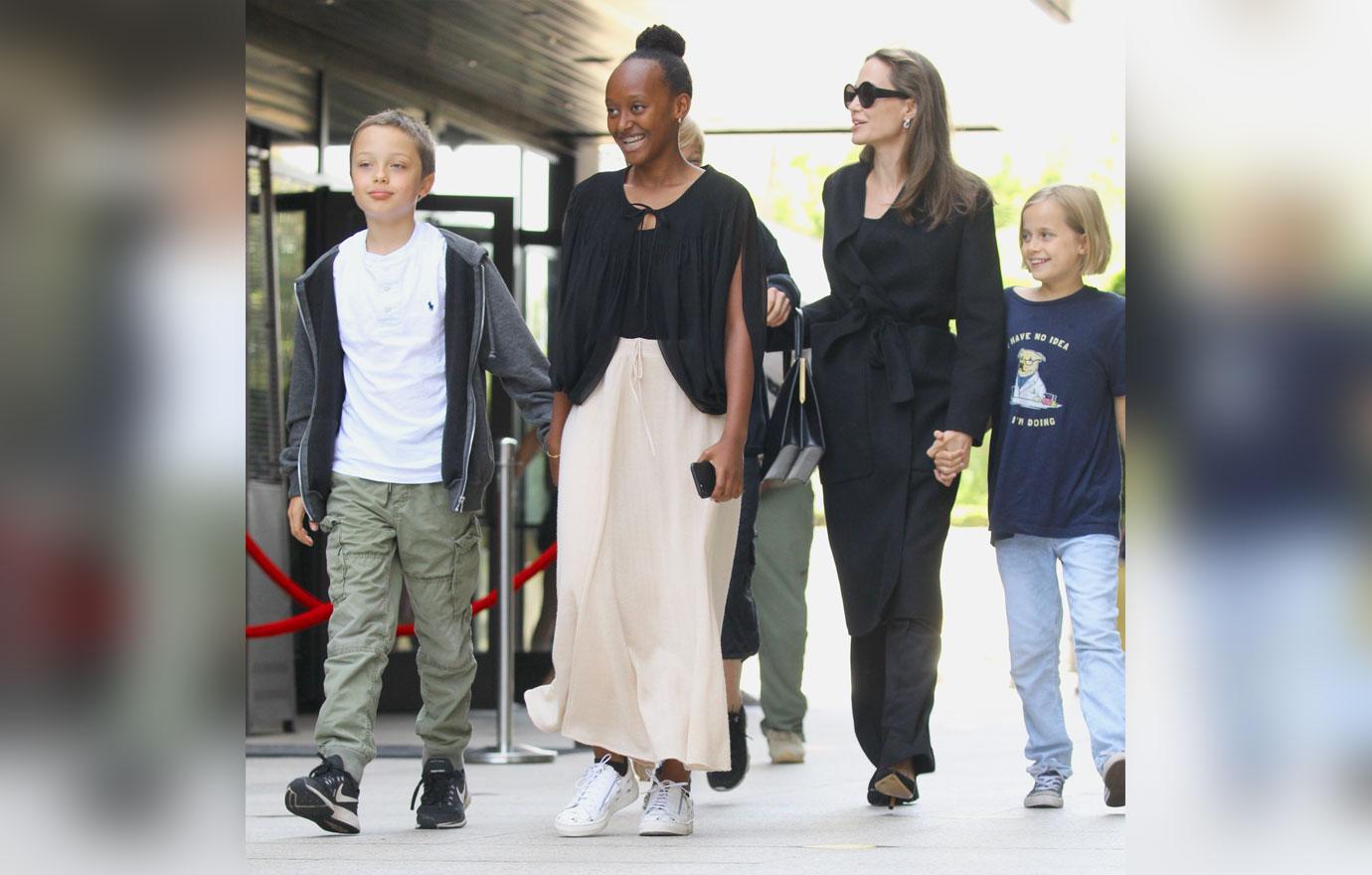 Angelina Jolie is all smiles exiting the cinema with her kids