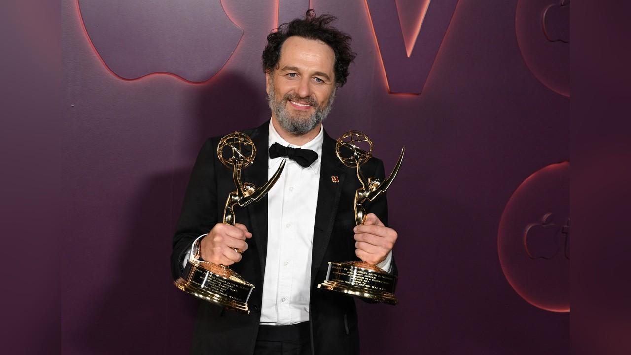 Image of Matthew Rhys proudly showed off his two Emmy statuettes while celebrating his major wins following the ceremony.