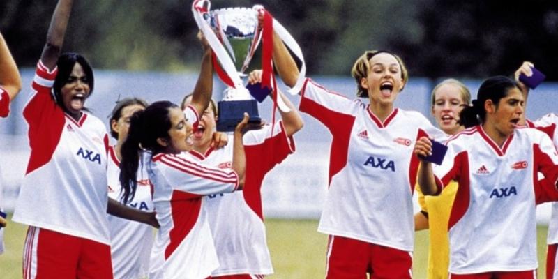 Parminder Nagra and Keira Knightley, in their soccer uniforms, shared a triumphant moment in Bend it Like Beckham.