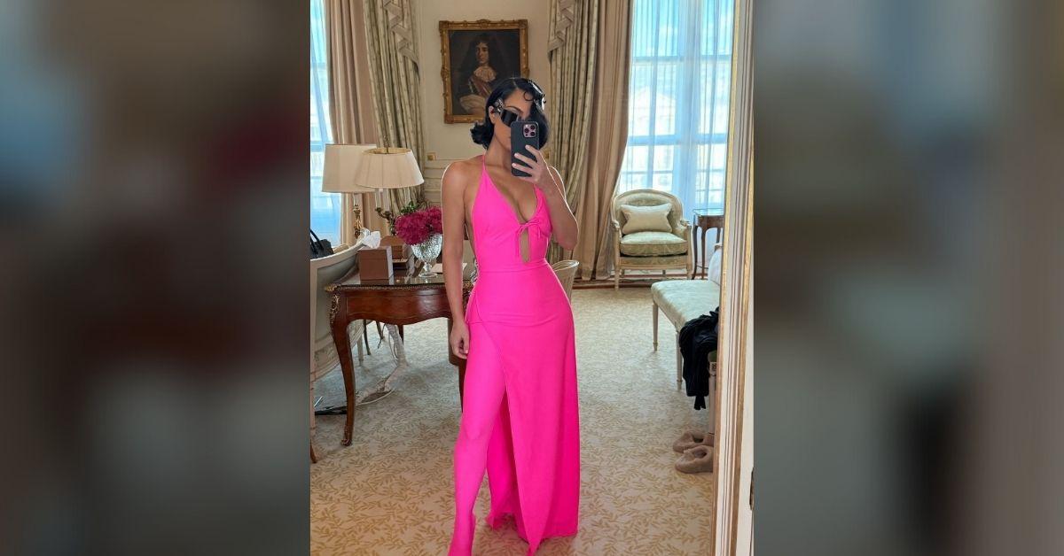 kim kardashian busts out tight neon pink dress paris fashion show