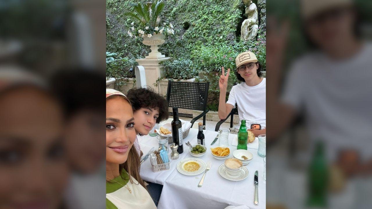 Photo of Jennifer Lopez took a photo as the trio enjoyed a meal outside.