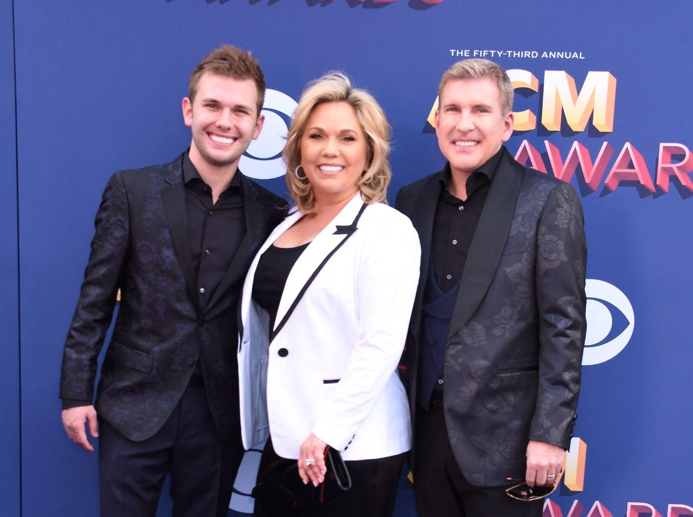 Photo of Chase Chrisley, Julie Chrisley and Todd Chrisley.