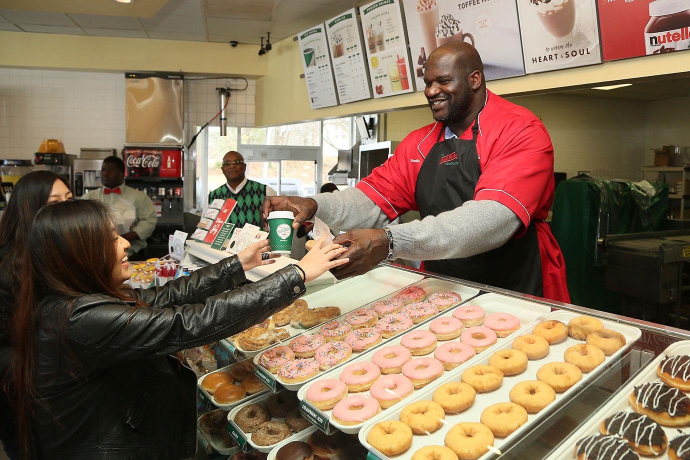 Shaquille O`Neal serves Krispy Kreme`s All New Freshly Brewed Coffee at the Store He Owns