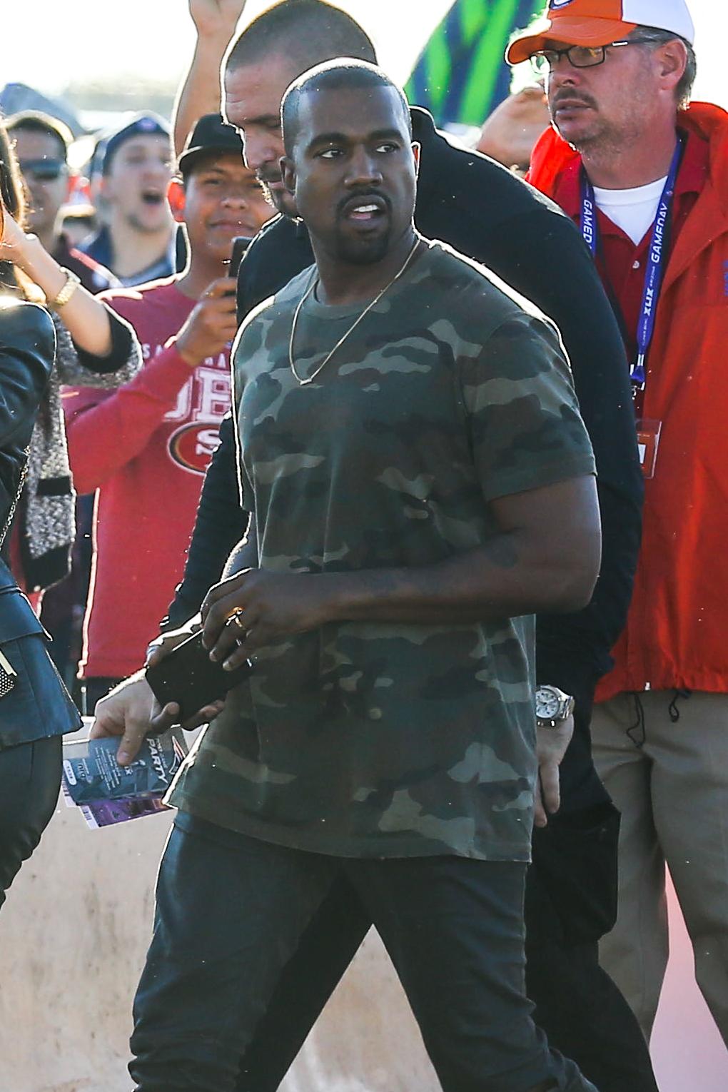 Kim Kardashian and Kanye West arrive for the Super Bowl XLIX