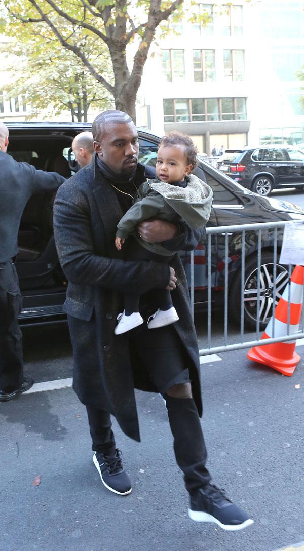 Kanye West, Kim Kardashian and baby North arrive at their apartment in Paris