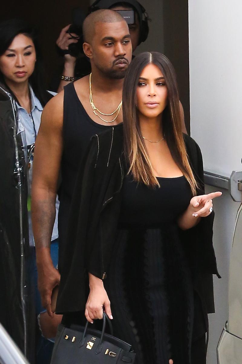 Kanye and Kim head out of the studio together in coordinating outfits