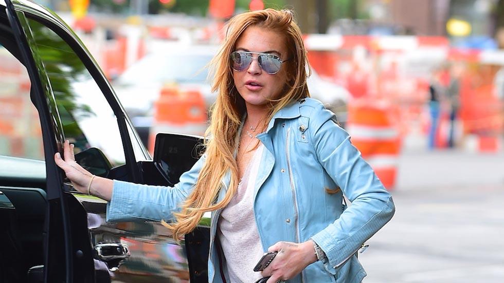 EXCLUSIVE!! Actress Lindsay Lohan leaves her new apartment, which