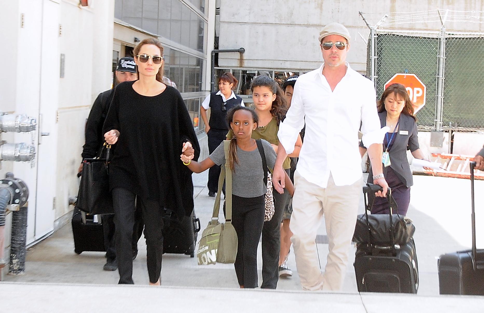 Brad Pitt and Angelina Jolie arrive at LAX