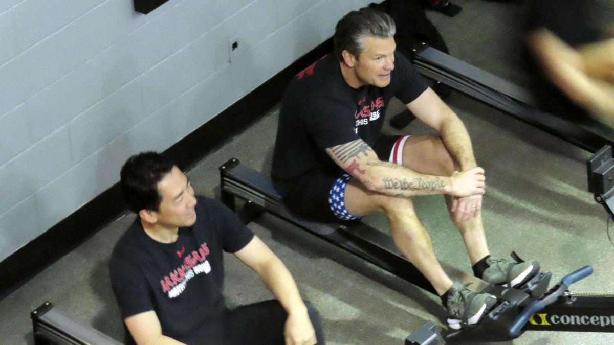 image of The defense chiefs were pictured using exercise machines alongside each other.