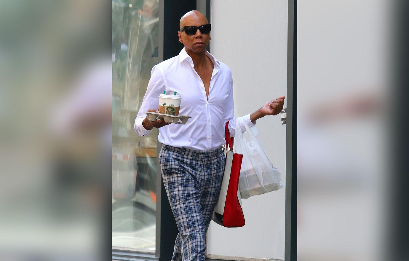 RuPaul walks the streets of Manhattan like its a runway while multitasking in NYC