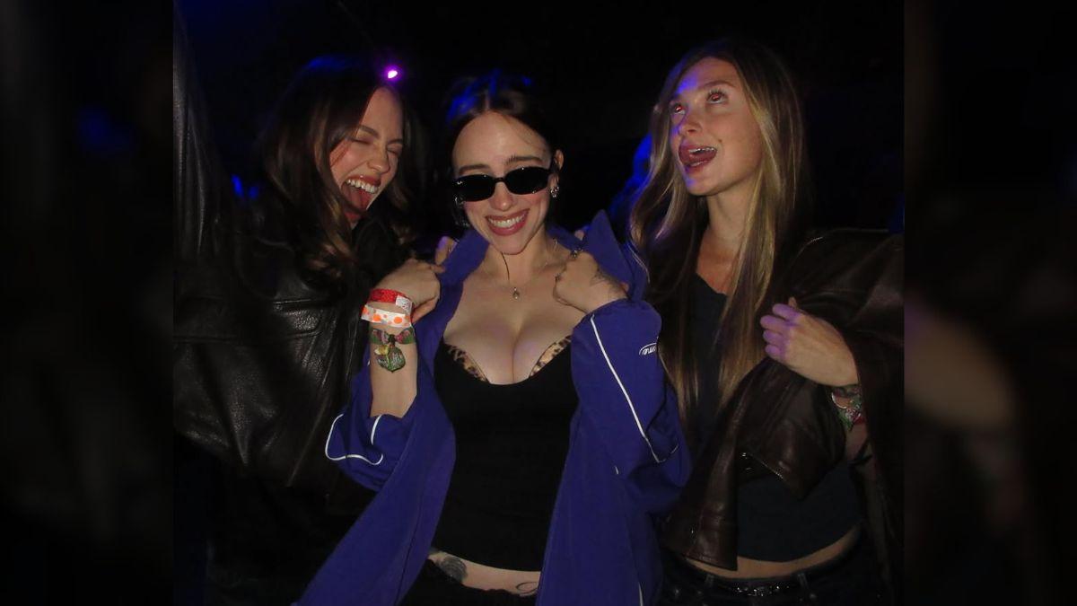 Photo of Billie Eilish sported a plunging top and low rise pants for an outing with her friends.