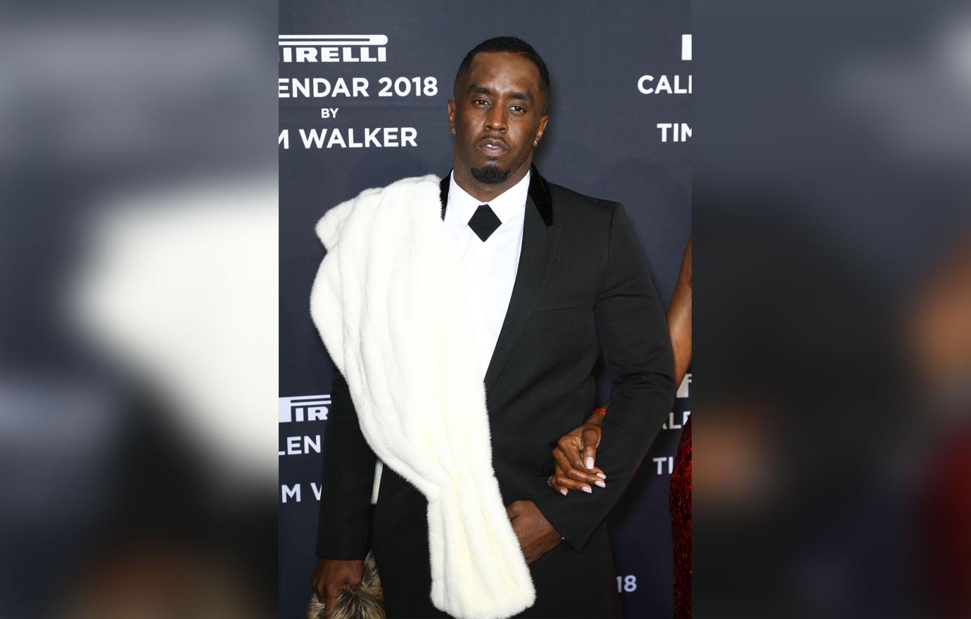 Diddy Wearing A white and black suit