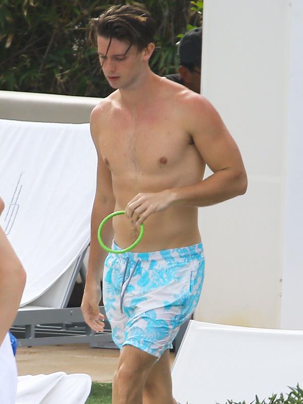 Patrick Schwarzenegger Enjoys The Pool WIth Friends In Miami