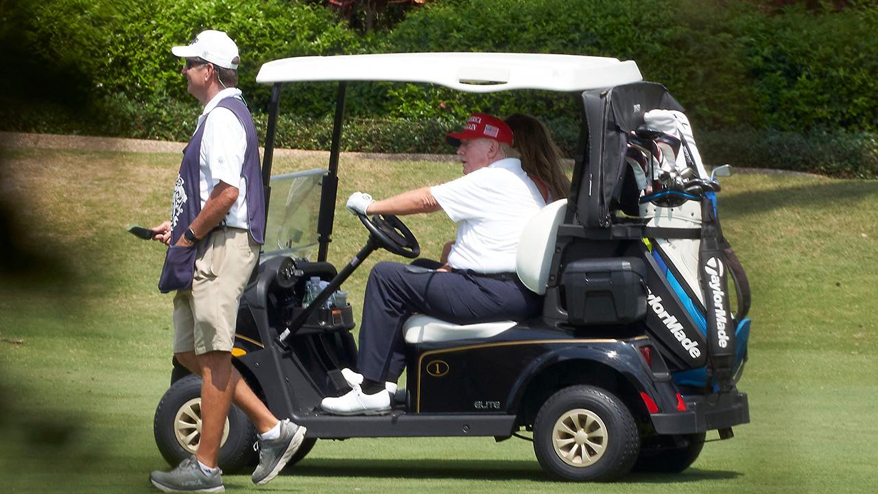 photo of The POTUS shared an edited photo of himself in a golf cart with Gary Player. 
