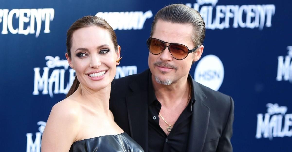 Angelina Jolie goes bra-less in little black vest after double