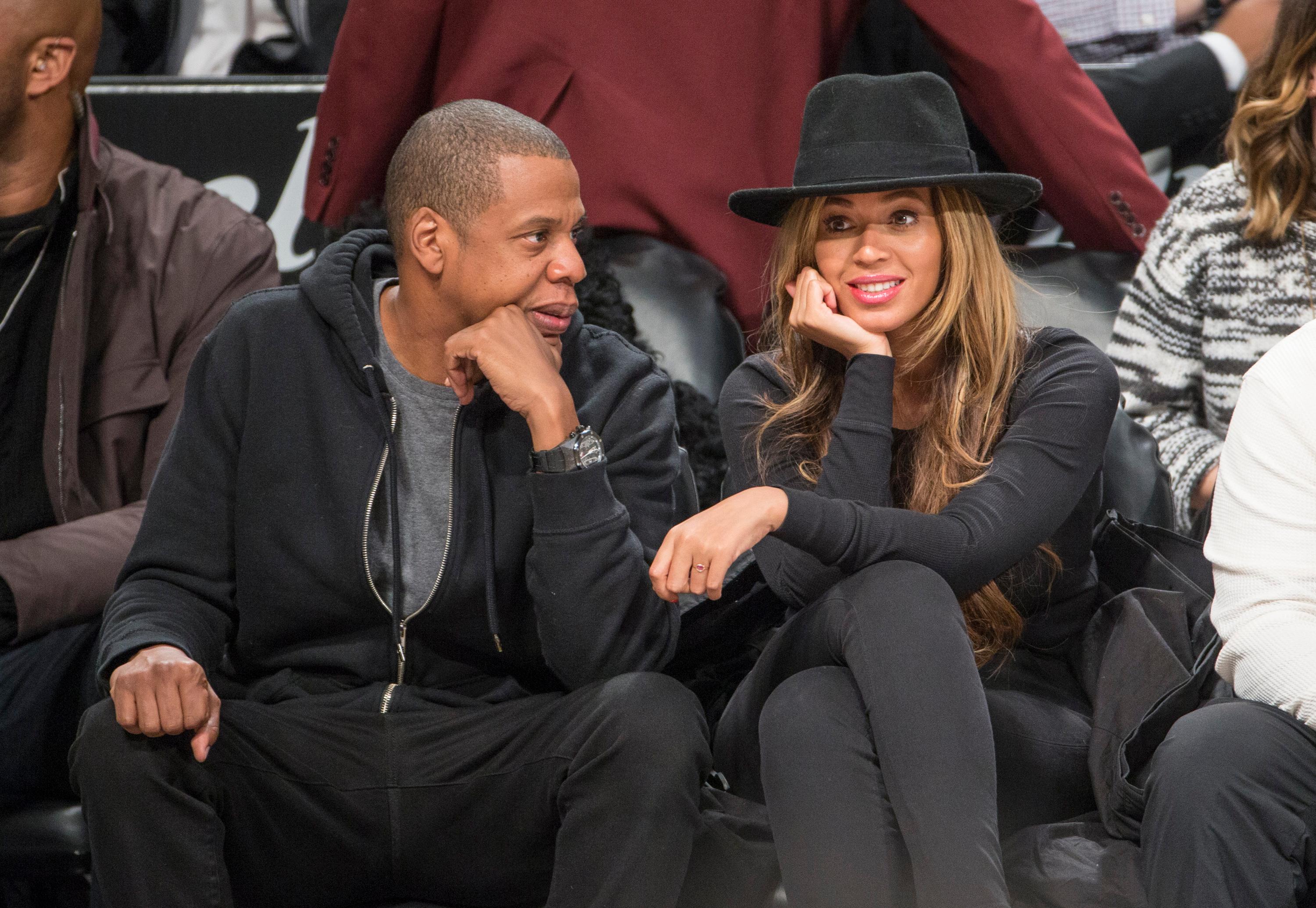 Jay Z and Beyonce sit courtside at the Brooklyn Nets game against the Houston Rockets