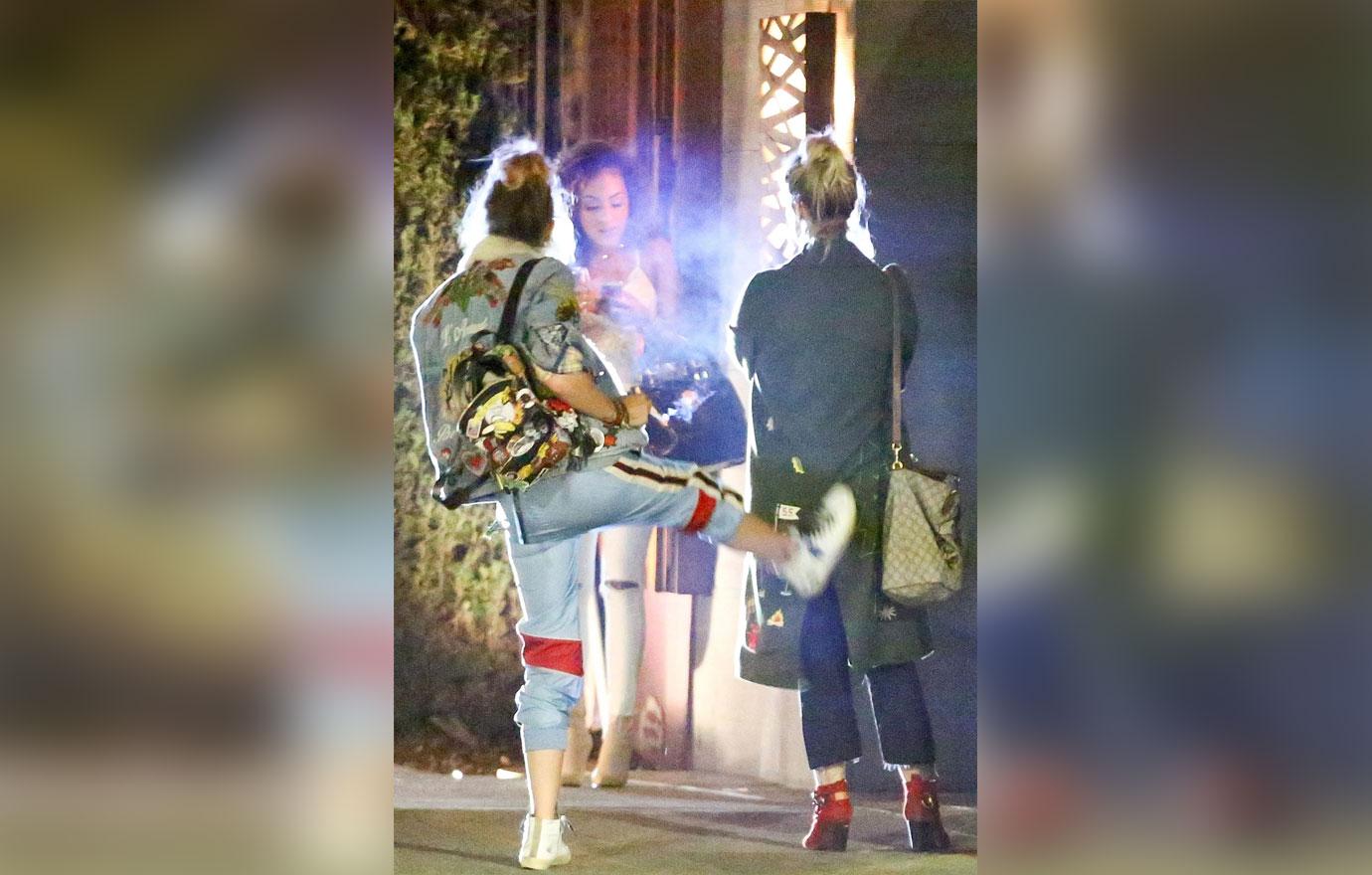 *EXCLUSIVE* Paris Jackson kicks her friend in the butt on the way out of Nobu in Malibu