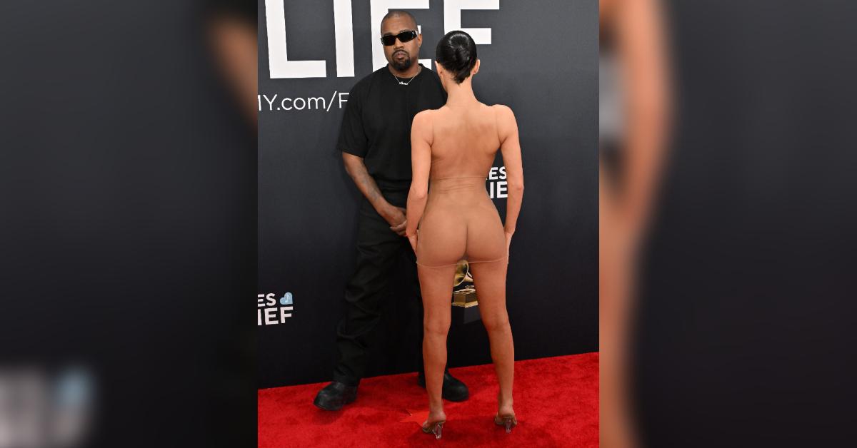 grammys security guard bianca censori coat red carpet outfit