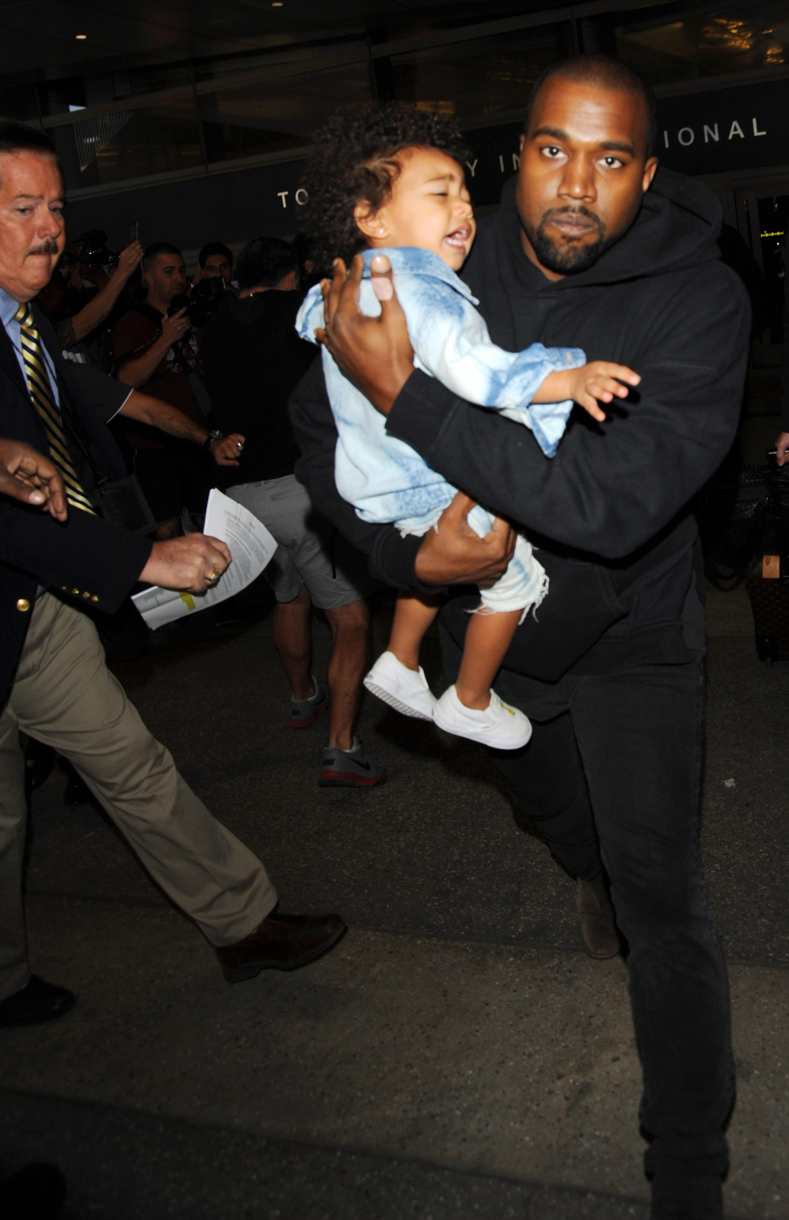 Kanye West served papers at LAX with Kim Kardashian and daughter North West