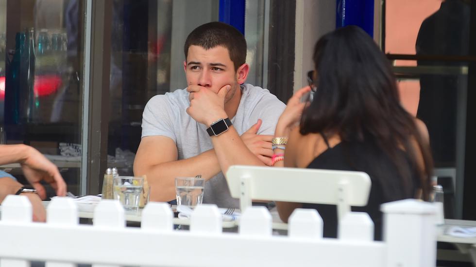 Nick Jonas looks glum as he eats lunch in the West Village