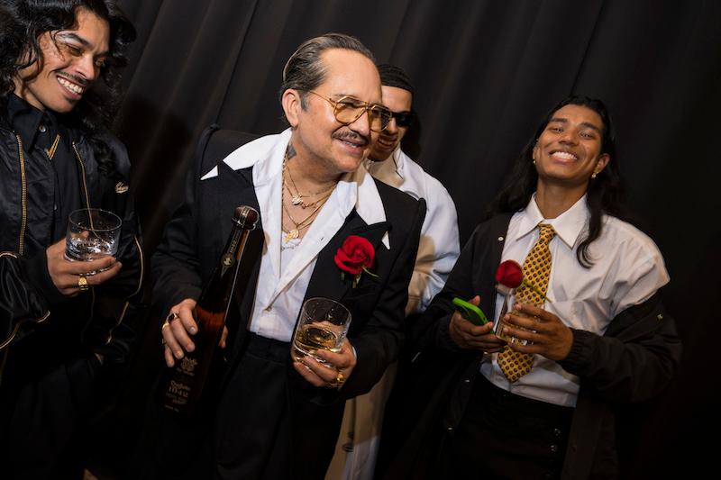 willy chavarria raises a glass with tequila don julio  surrounded by his cast and crew in celebration of the debut of his fall winter  collection during new york fashion week on february