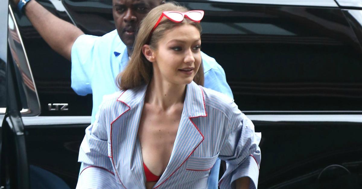 Gigi Hadid barely noticed as her boobs nearly slipped out of her red bra (w...