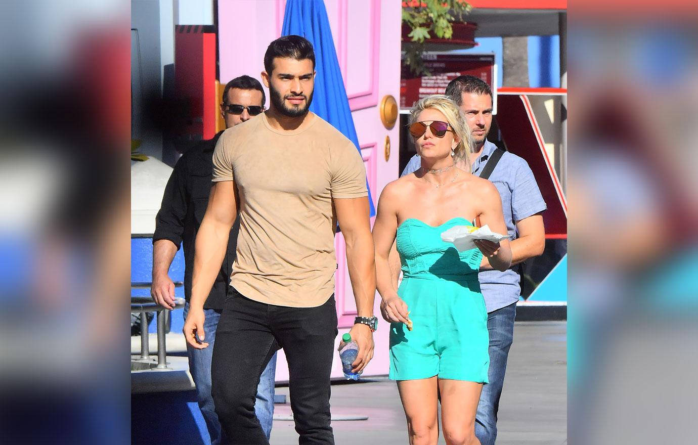 Sam Asghari and Britney Spears holding hands