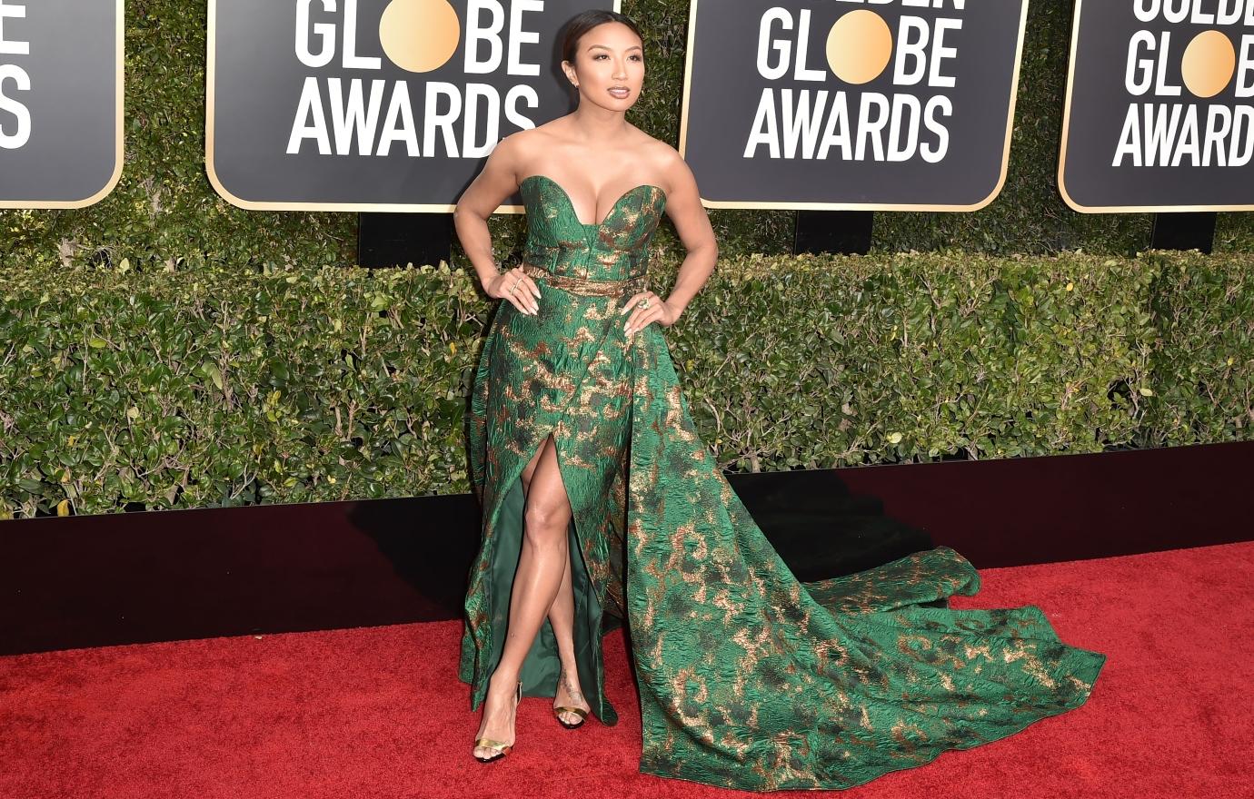 Jeanie Mai attends the Golden Globes in a green gown