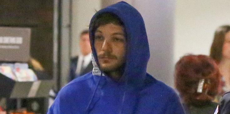 Louis Tomlinson airport arrest blue hoodie long