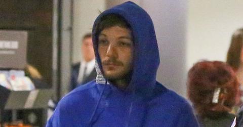 Louis Tomlinson airport arrest blue hoodie long