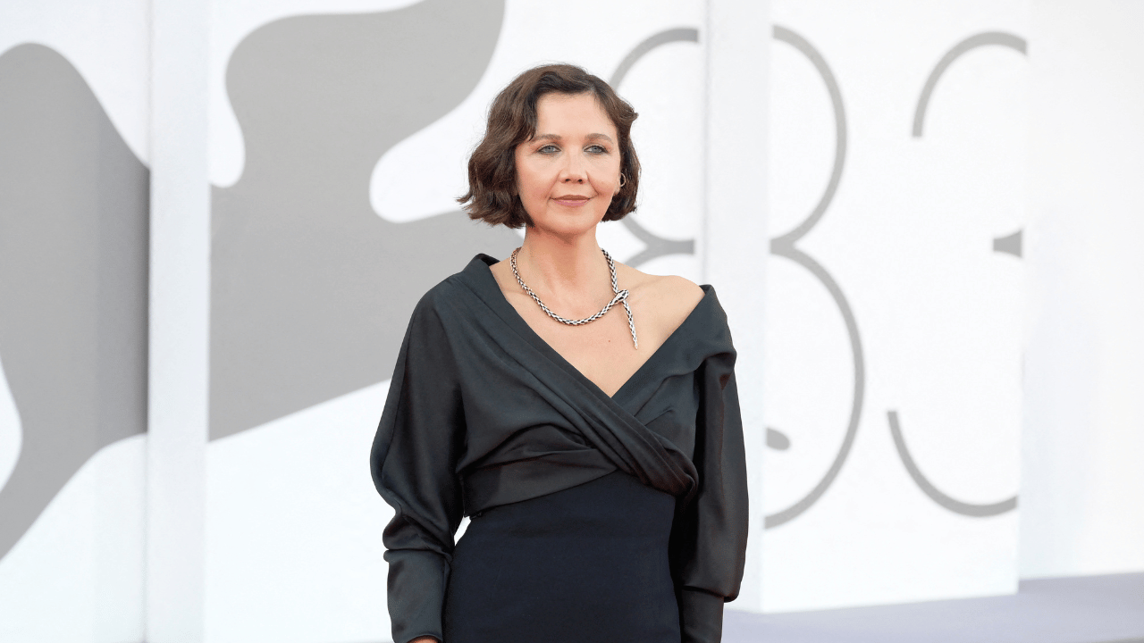 Image of Maggie Gyllenhaal, who serves as president of the 2026 Venice Film Festival jury, commanded attention in a dramatic black Balenciaga gown.
