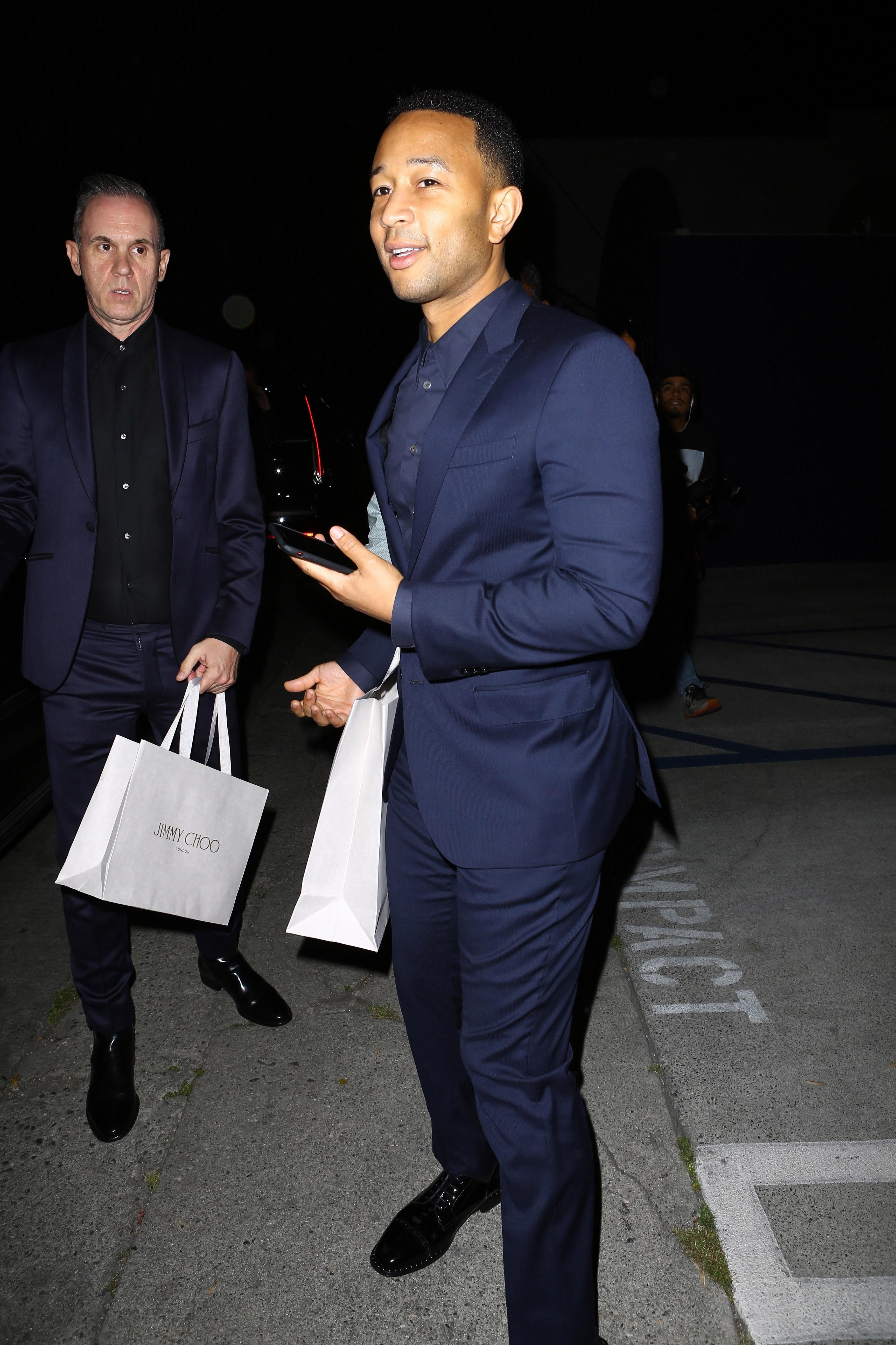 John Legend looks suave in a navy blue suit at the Power Stylists Dinner