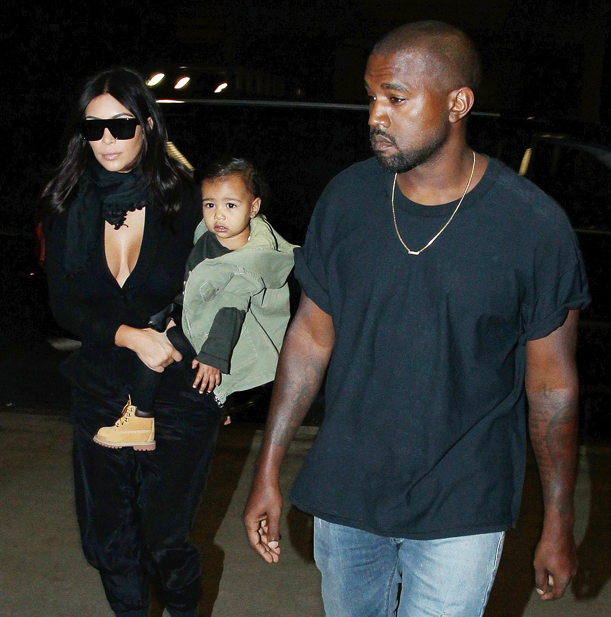 Kim Kardashian, husband Kanye West and baby North West depart from Los Angeles International Airport ***NO DAILY MAIL SALES****