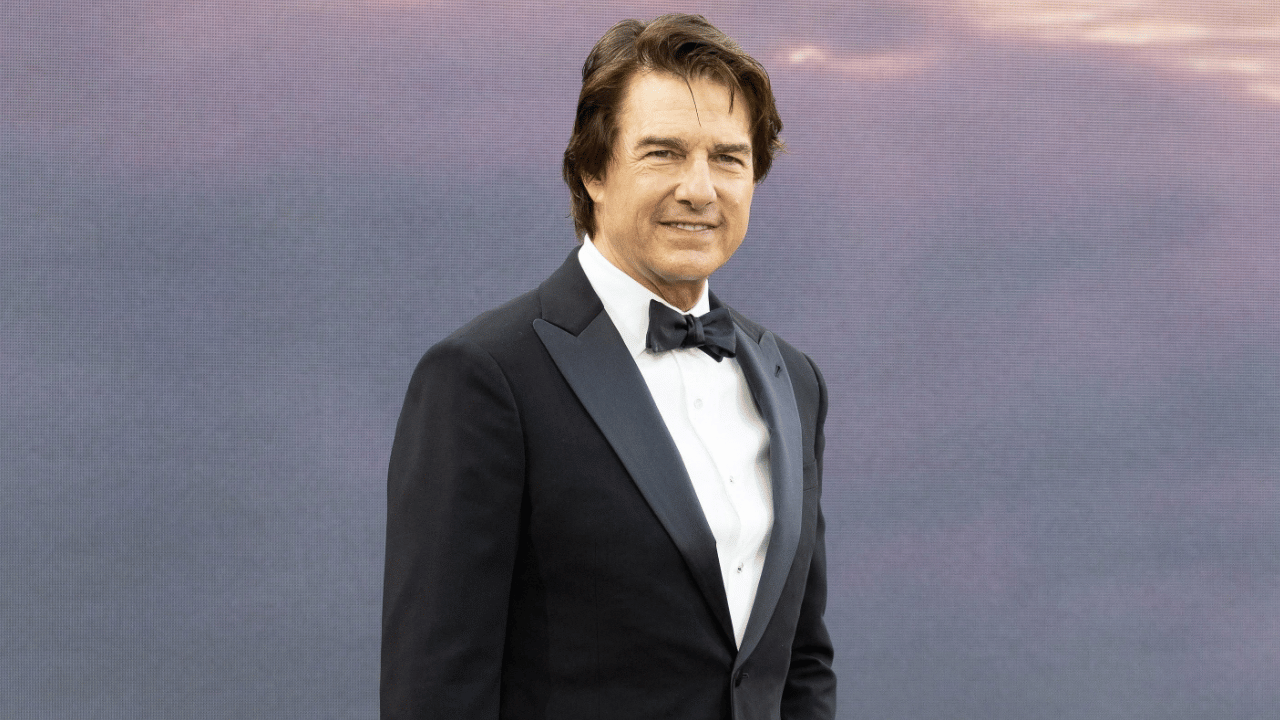 Image of Tom Cruise kept things classic for the occasion, stepping onto the carpet in a sharp black tuxedo and matching bow tie.