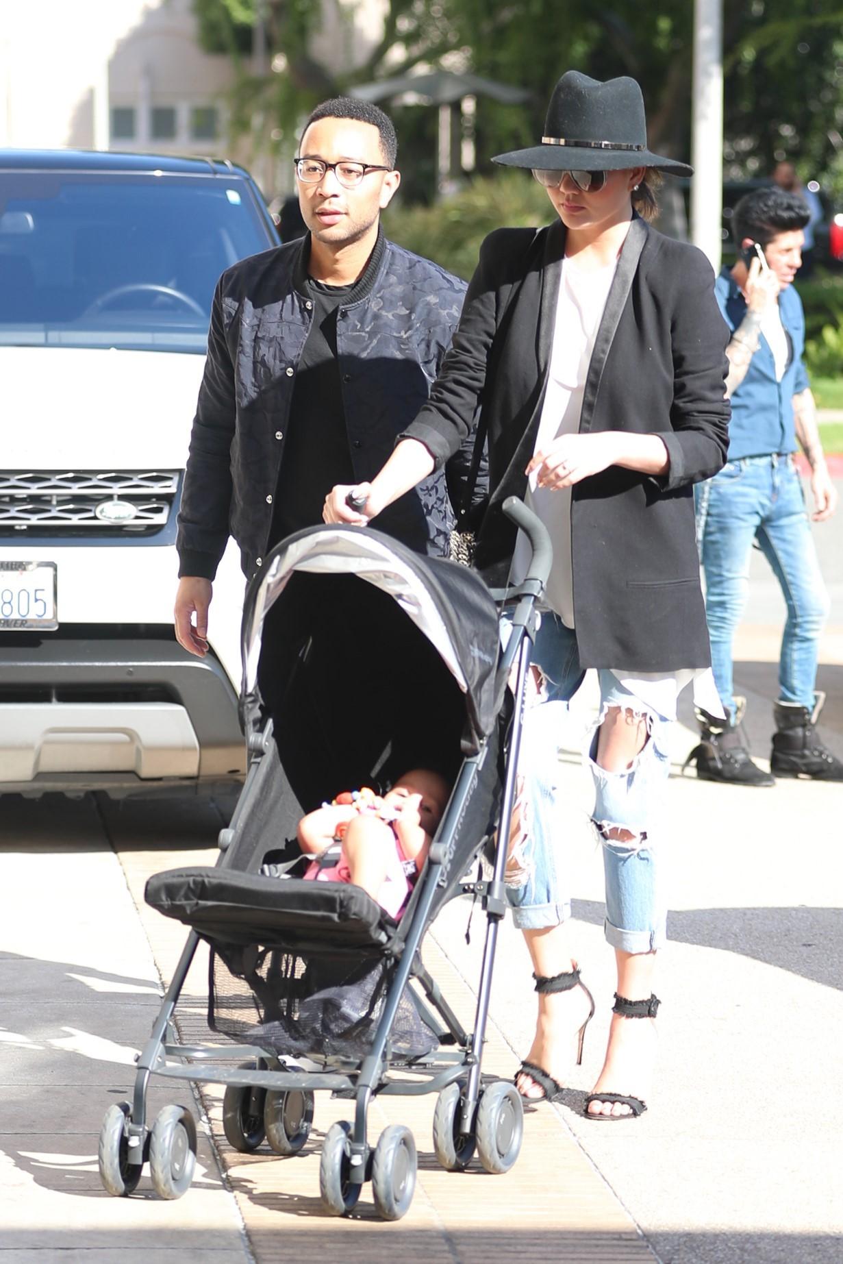 John Legend and Chrissy Teigen take their daughter shopping at Barneys New York