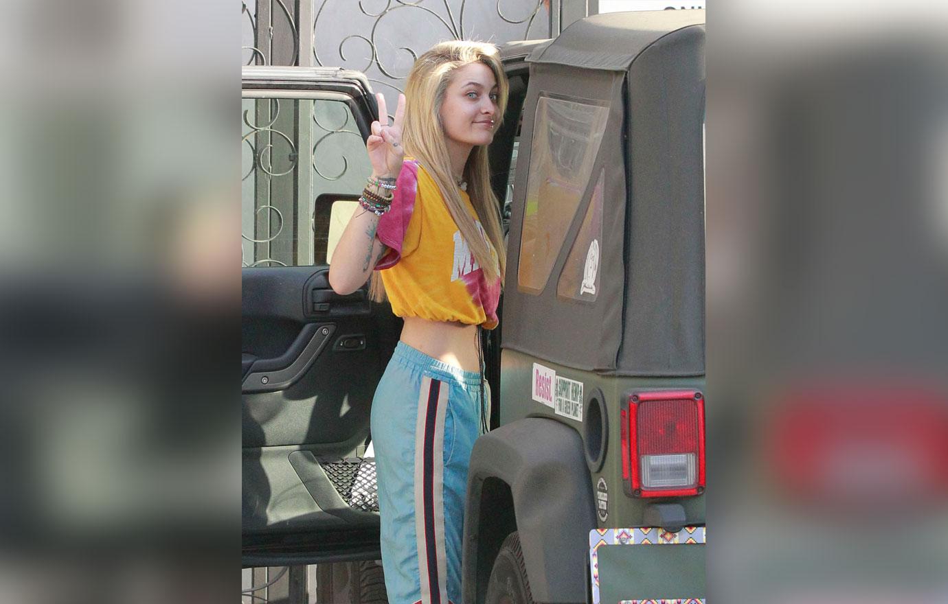 Paris Jackson seen for the first time after her grandfather Joe Jackson passed away last week, as she walks out of the salon with extension light hair do. She showed her flat tummy while giving peace to the photographers