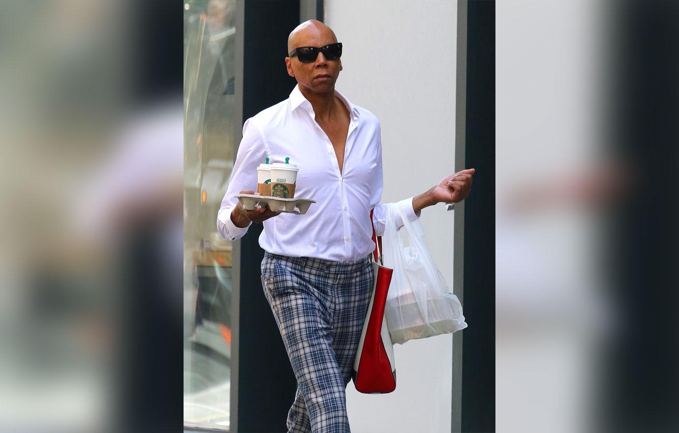 RuPaul walks the streets of Manhattan like its a runway while multitasking in NYC