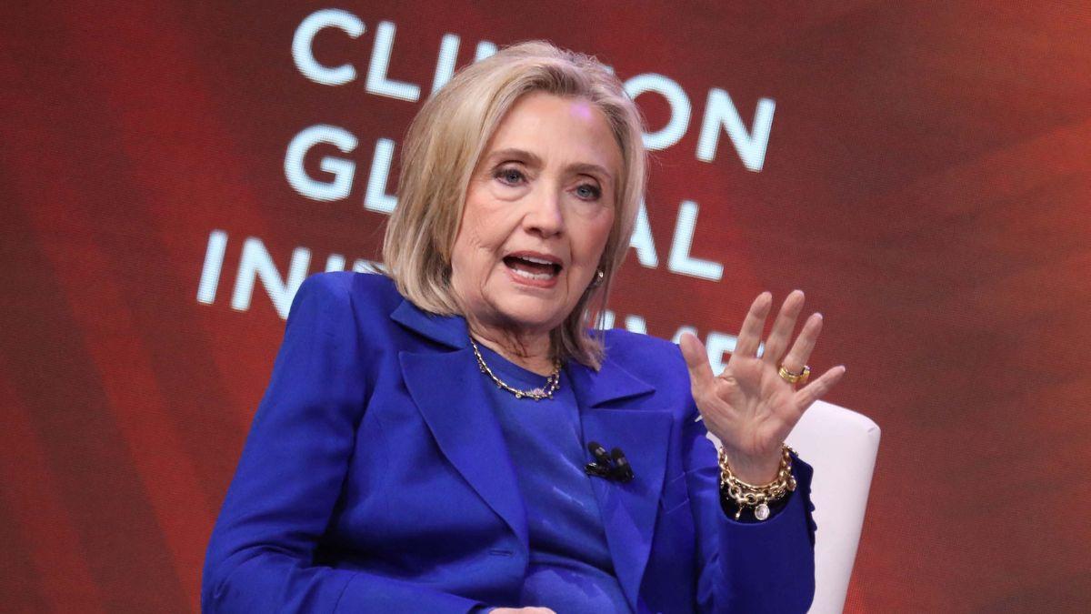 Image of Despite the brief levity, the deposition was halted when Hillary Clinton left the room over a leaked photo.