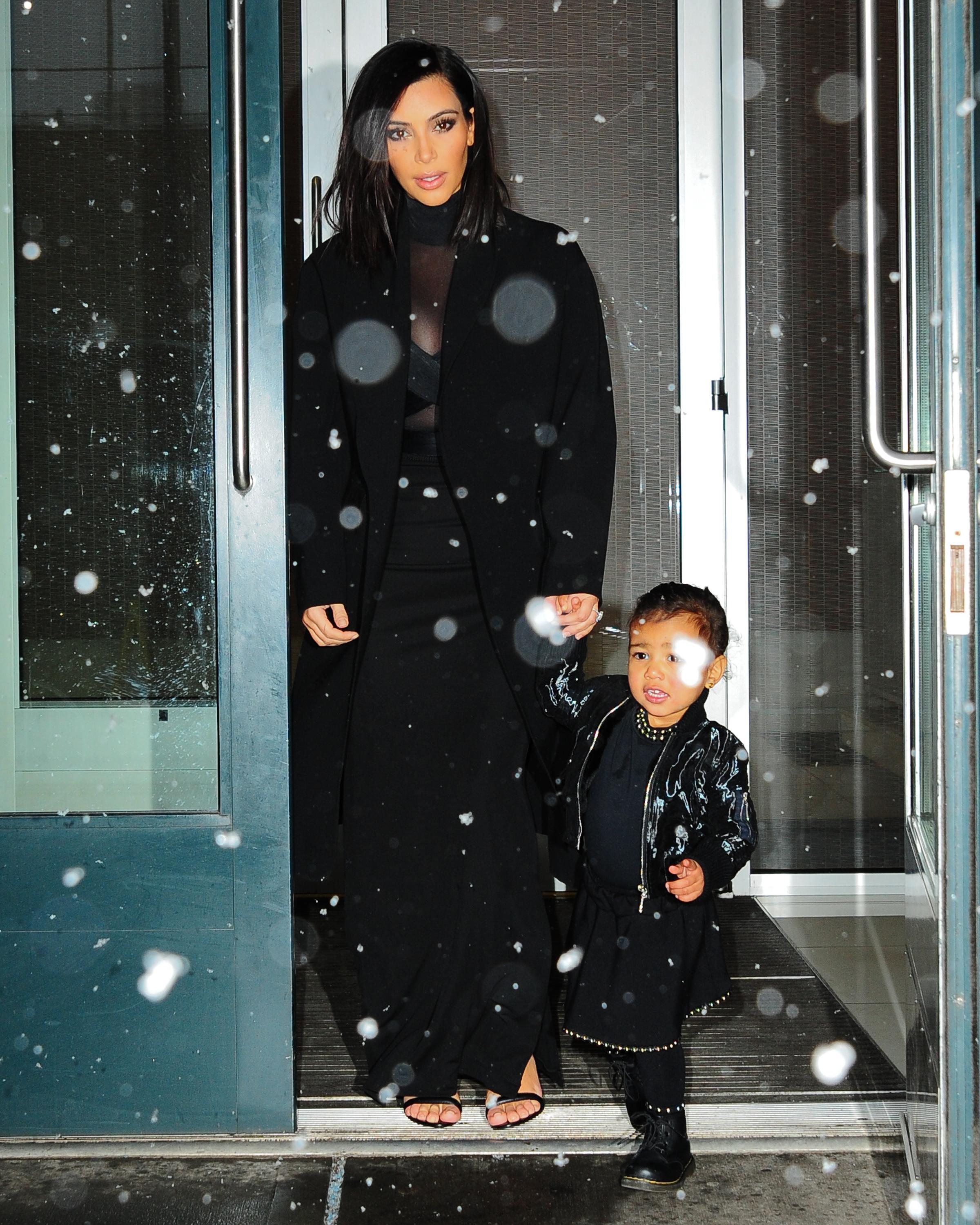 Kanye West, Kim Kardashian and North West enjoy the snow on their way to a fashion show in New York City ***NO DAILY MAIL SALES***