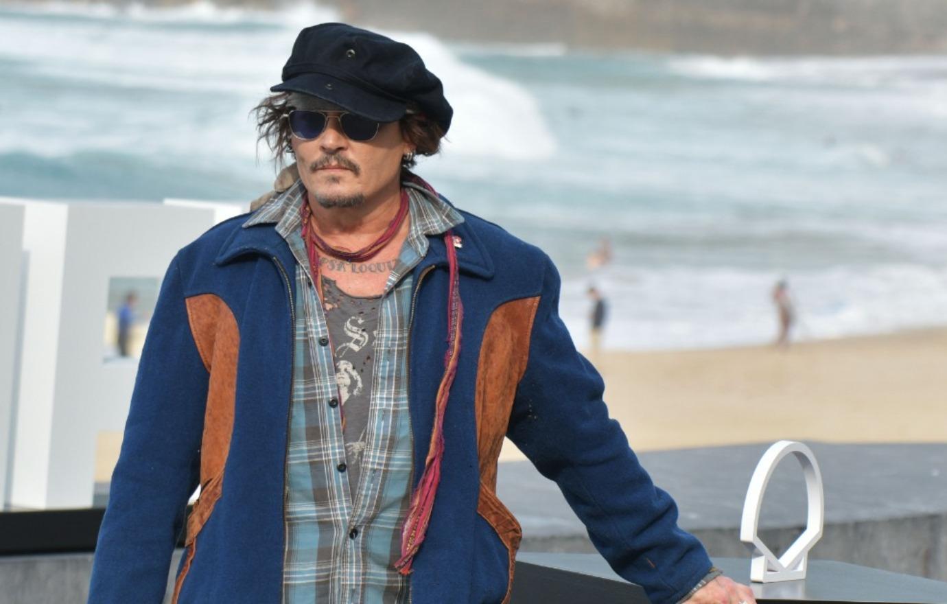 johnny depp rakes in  million dollars art sales